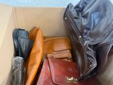 a lot of bags in a cardboard box on the floor