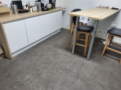 a small kitchen with a table and chairs in it