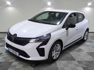the white car is parked on a checkered floor in a garage