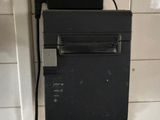 a black box with a printer on top of it in a bathroom