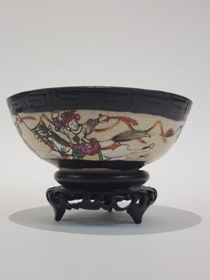 a black and white bowl with a design on it