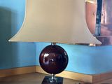 a lamp that is sitting on a table in a room