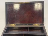 an old wooden box with two compartments on top of it