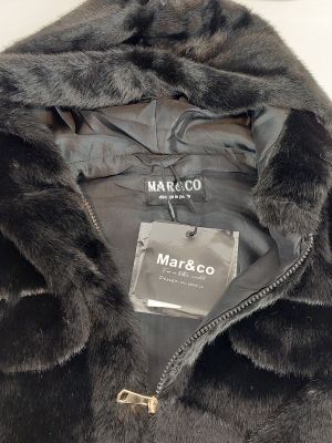 the jacket is black and has a fur lining around the collar