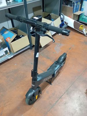 a scooter that is sitting on the floor in a room