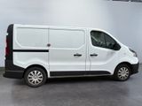 the white van is parked in the garage with its door open