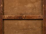 an old wooden picture frame with a piece of wood on top of it