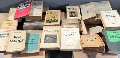 a lot of old books on a table together