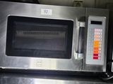 an image of a stainless steel microwave oven in a kitchen