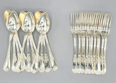 a lot of silver spoons and spoons on the table