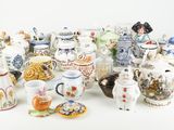 many different types of pottery on the table