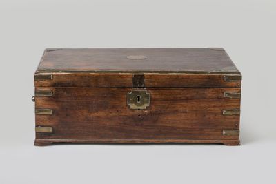 an old wooden box with a metal latch on the top