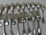 a lot of silver spoons and forks on the table