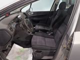 the interior of a car with black seats and a steering wheel