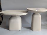two tables that are sitting next to each other on a table