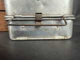 a small metal box with a handle on it