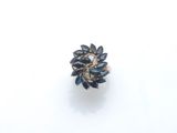 a close up of a ring on a white surface