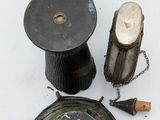 three spools and a candle holder on a table