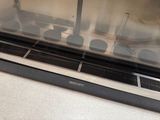 a glass display case with a bunch of food inside of it