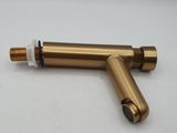 a close up of a brass pipe with a white cap