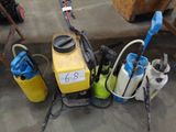 a yellow and blue sprayer sitting on the floor next to other items