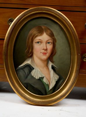 portrait of a young woman in a green dress and white collared shirt