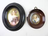 two framed pictures hanging on the wall next to each other