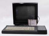 a computer with a keyboard and a monitor on a table