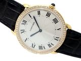 a close up of a wrist watch with roman numerals