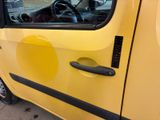 a small yellow car with a steering wheel and a steering knob