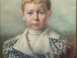 portrait of a young boy in a white scarf and black dress