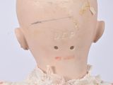 a doll with a head made of a doll ' s head