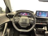 the interior of a car with a steering wheel, dashboard, and display screen