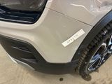 a close up of a car ' s front bumper with a sticker on it