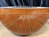 a wooden bowl that is sitting on a table