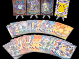 pokemon trading cards are displayed in a row on a black background