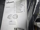 a manual for a machine that is sitting on a table