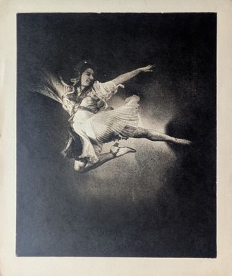 an old black and white photo of two dancers in the air
