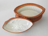 pair of brown and white ceramic bowls on a white surface