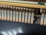 a close up of a piano that is being played by someone