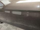 a close up of a car ' s front bumper with the door open