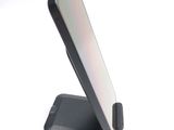 a cell phone that is sitting on top of a stand