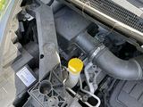 a car engine with the hood open and the hood down
