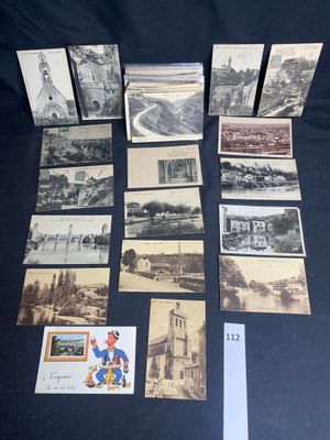 an assortment of old postcards and postcards on a table
