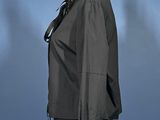 an image of a mannequin wearing a black jacket and black pants