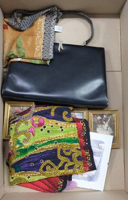 a box with a purse and other items inside of it