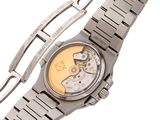 a watch that is sitting on a bracelet on a white surface