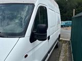 a white van that is parked on the side of the road