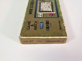a box with a clock on it sitting on a table