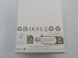 the box is white and has a green sticker on it